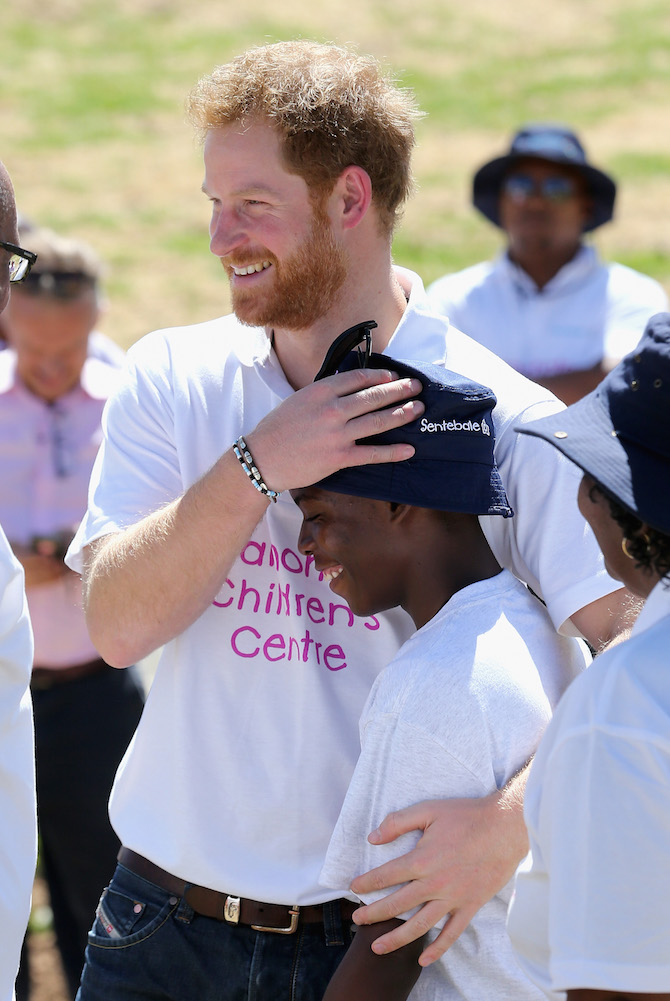 MASERU, LESOTHO - NOVEMBER 26:  In this handout provided by Sentebale, Prince Harry hugs 'Mutso' a young boy he made friends with on his first visit to Lesotho at the Official Opening of the new Mamohato Children's Centre on October 17, 2015 in Maseru, Lesotho. In a photography project supported by Getty Images the vulnerable children at the Mamohato Camp have been using Instant photography as an educational tool to build interpersonnel skills and creativity. The Sentebale Mamohato Children's Centre at Thaba Bosiu just outside Maseu is Sentebale's first purpose built camp for the disadvantaged and HIV positive childen of Lesotho. Getty Images  Sentebale is a charity started by Prince Harry and Prince Seeiso of Lesotho ten years ago to help the vulnerable children of Lesotho.  (Photo by Chris Jackson/Getty Images for Sentebale)