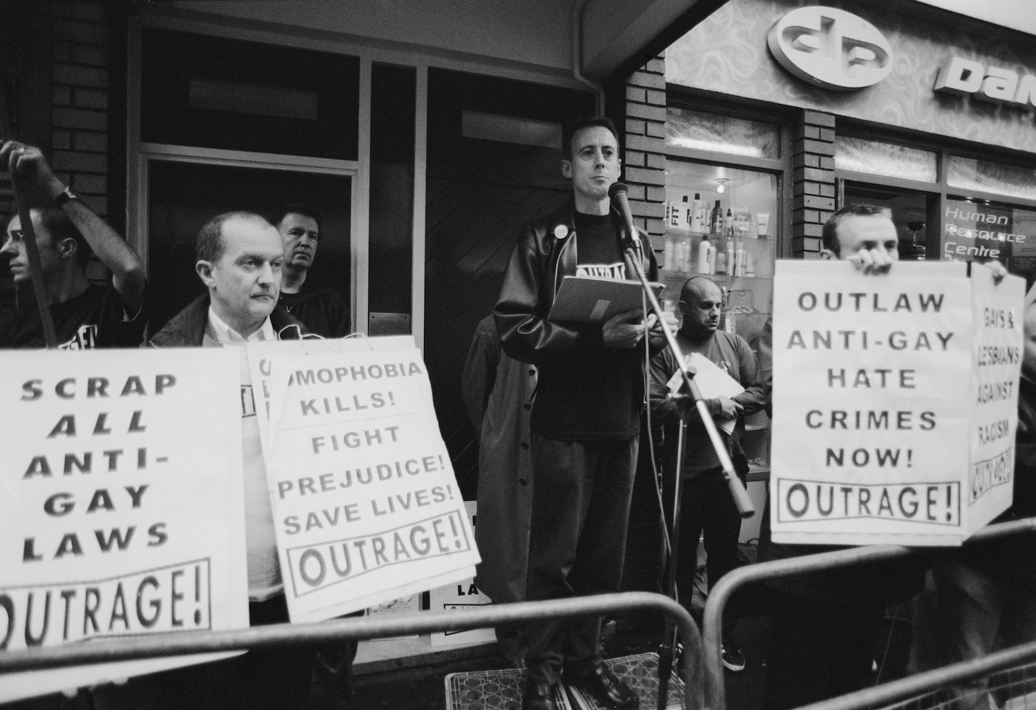Human rights activist Peter Tatchell (centre) at a vigil organized by the direct action gay rights campaigning group OutRage! in Old Compton Street, Soho, London, 7th May 1999. The gathering follows the bombing of the Admiral Duncan, a gay pub on the street, by Neo-Nazi David Copeland on April 30th. (Photo by Steve Eason/Getty Images)