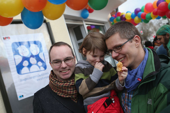 Gay couple Kai and Michael Korok and their daughter Jana