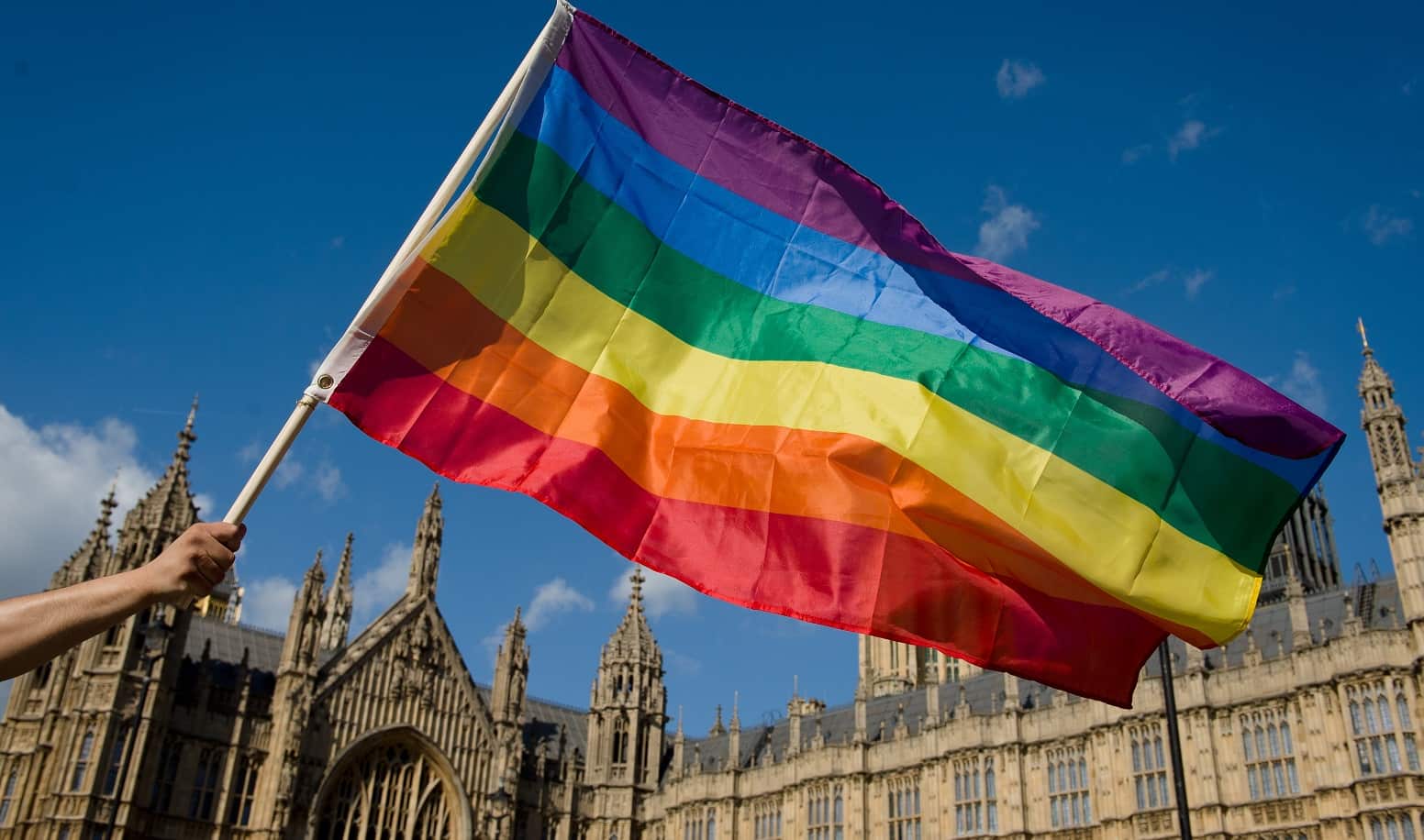 A rainbow flag above Parliament
