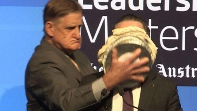 An evangelical who opposes marriage equality attacks gay CEO Alan Joyce with a pie