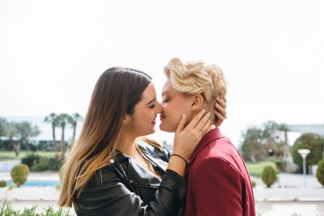 Lesbians sharing a kiss