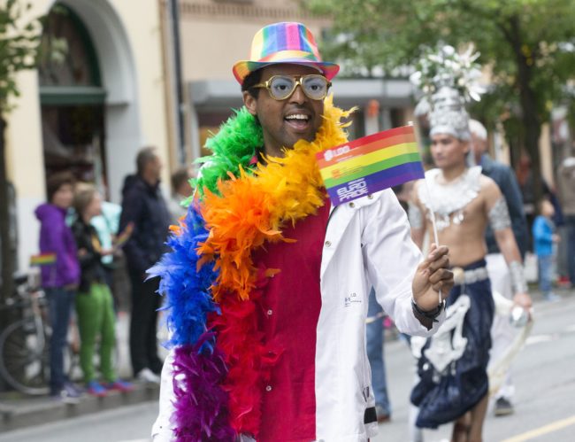 A participant of 'Euro Pride' parade is pictured with a rainbow flag in Oslo in 2014. (Bendiksby, Terje/AFP/Getty Images) 