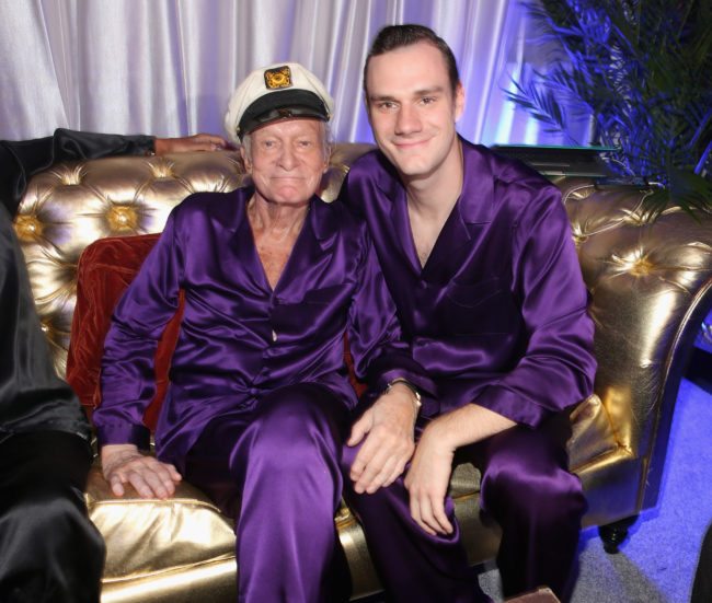 HOLMBY HILLS, CA - AUGUST 16:  Hugh Hefner (L) and Cooper Hefner attend the Annual Midsummer Night's Dream Party at the Playboy Mansion hosted by Hugh Hefner on August 16, 2014 in Holmby Hills, California.  (Photo by Christopher Polk/Getty Images for Playboy)
