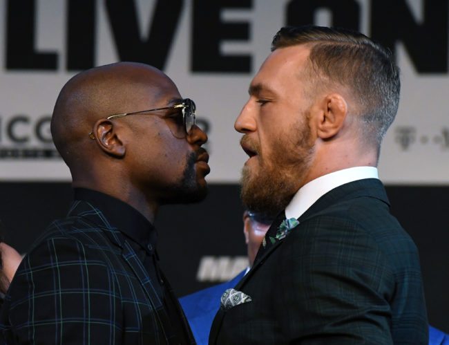 LAS VEGAS, NV - AUGUST 23:  Boxer Floyd Mayweather Jr. (L) and UFC lightweight champion Conor McGregor face off during a news conference at the KA Theatre at MGM Grand Hotel & Casino on August 23, 2017 in Las Vegas, Nevada. The two will meet in a super welterweight boxing match at T-Mobile Arena on August 26 in Las Vegas.  (Photo by Ethan Miller/Getty Images)