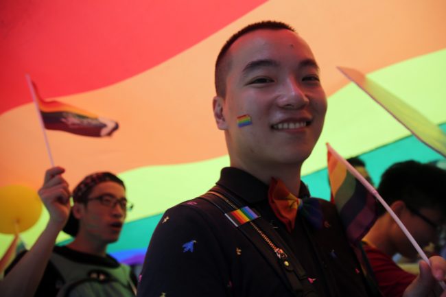 People march in the Lesbian, Gay, Bi-sexual and Transgender (LGBT) parade in Hong Kong on November 6, 2015.  Hong Kong's streets were coloured by rainbow flags as protesters marched in the city's annual gay pride parade to call for equality and same-sex marriage.   AFP PHOTO / ISAAC LAWRENCE        (Photo credit should read Isaac Lawrence/AFP/Getty Images)