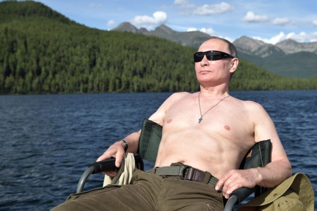 TOPSHOT - Russian President Vladimir Putin sunbathes during his vacation in the remote Tuva region in southern Siberia. The picture taken between August 1 and 3, 2017. / AFP PHOTO / SPUTNIK / Alexey NIKOLSKY (Photo credit should read ALEXEY NIKOLSKY/AFP/Getty Images)