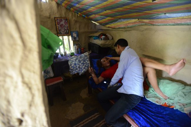 This photo taken on August 21, 2017 shows Nepali transgender person Monika Shahi Nath Yogi and her husband Ramesh Nath Yogi talking in a bedroom in Lamki in Nepal's Kailali district. Monika Shahi Nath, 40, became Nepal's first transgender person to be issued with a marriage certificate by district officials when she married 22-year-old Ramesh Nath Yogi in May, even though Nepal has no formal laws for such unions. The couple have found a rare acceptance in Nepal, where many transgender people still struggle to be open about their identity despite progressive laws that include a third gender option on identity cards and passports. / AFP PHOTO / Prakash MATHEMA / TO GO WITH Nepal-transgender-marriage-rights        (Photo credit should read PRAKASH MATHEMA/AFP/Getty Images)