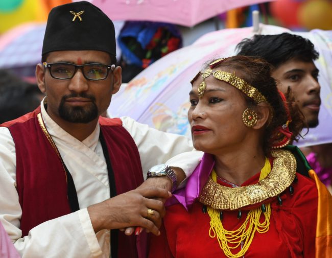 This photo taken on August 8, 2017 shows Nepali transgender person Monika Shahi Nath taking part in a gay pride parade in Kathmandu. Monika Shahi Nath, 40, became Nepal's first transgender person to be issued with a marriage certificate by district officials when she married 22-year-old Ramesh Nath Yogi in May, even though Nepal has no formal laws for such unions. The couple have found a rare acceptance in Nepal, where many transgender people still struggle to be open about their identity despite progressive laws that include a third gender option on identity cards and passports. / AFP PHOTO / Prakash MATHEMA / TO GO WITH Nepal-transgender-marriage-rights (Photo credit should read PRAKASH MATHEMA/AFP/Getty Images)