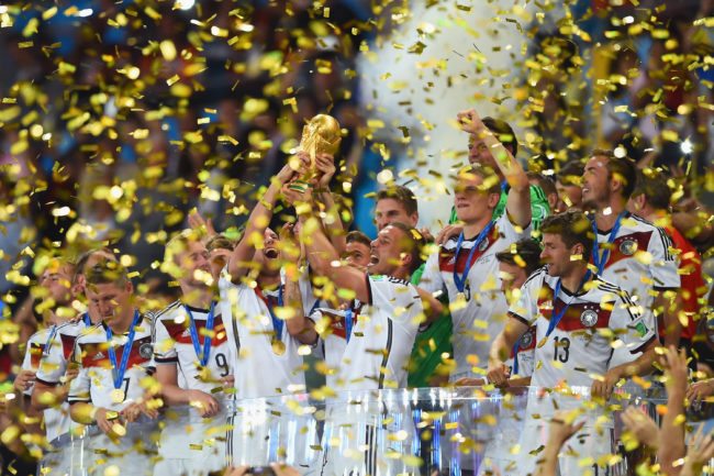 RIO DE JANEIRO, BRAZIL - JULY 13: Germany celebrate with the World Cup trophy  after defeating Argentina 1-0 in extra time during the 2014 FIFA World Cup Brazil Final match between Germany and Argentina at Maracana on July 13, 2014 in Rio de Janeiro, Brazil.  (Photo by Matthias Hangst/Getty Images)