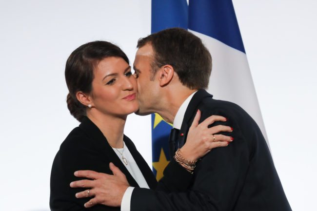 French President Emmanuel Macron (R)and French Junior Minister for Gender Equality Marlene Schiappa kiss after delivering a speech during the International Day for the Elimination of Violence Against Women, on November 25, 2017 at the Elysee Palace in Paris. / AFP PHOTO / POOL / LUDOVIC MARIN        (Photo credit should read LUDOVIC MARIN/AFP/Getty Images)