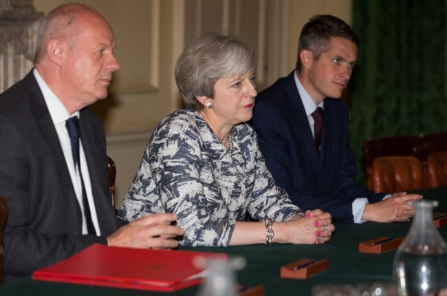 LONDON, ENGLAND - JUNE 26:  Prime Minister Theresa May (2L) sits with First Secretary of State Damian Green (L), and Parliamentary Secretary to the Treasury, and Chief Whip, Gavin Williamson (3L) as they talk with Democratic Unionist Party (DUP) leader Arlene Foster, DUP Deputy Leader Nigel Dodds, and DUP MP Jeffrey Donaldson (not seen) inside 10 Downing Street on June 26, 2017 in London, England. Prime Minister Theresa May's Conservatives signed a deal Monday with Northern Ireland's Democratic Unionist Party that will allow them to govern after losing their majority in a general election this month. (Photo by Daniel Leal-Olivas - WPA Pool /Getty Images)