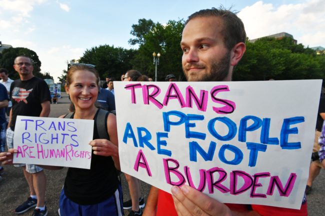 Protesters gather in front of the White House on July 26, 2017, in Washington, DC. Trump announced on July 26 that transgender people may not serve "in any capacity" in the US military, citing the "tremendous medical costs and disruption" their presence would cause. / AFP PHOTO / PAUL J. RICHARDS (Photo credit should read PAUL J. RICHARDS/AFP/Getty Images)