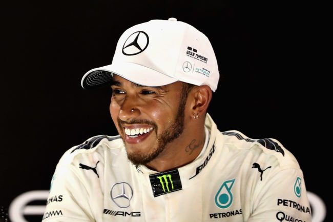 ABU DHABI, UNITED ARAB EMIRATES - NOVEMBER 26:  Second place finisher Lewis Hamilton of Great Britain and Mercedes GP celebrates with his trophy on the podium during the Abu Dhabi Formula One Grand Prix at Yas Marina Circuit on November 26, 2017 in Abu Dhabi, United Arab Emirates.  (Photo by Mark Thompson/Getty Images)