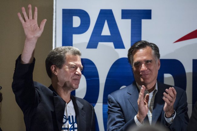 OVERLAND PARK, KS - OCTOBER 27: Kansas Governor Sam Brownback (L) and  Former Massachusetts Former Massachusetts Gov. Mitt Romney stump for Senator Pat Roberts campaign together at the Prairie Fire shopping center October 27, 2014 in Overland Park, Kansas.  Ahead of Midterm Elections, Romney has joined a number of national Republican political figures to stump for Roberts who is facing a close race with independent Greg Orman. (Photo by Julie Denesha/Getty Images)