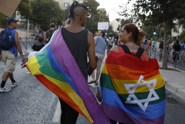 Participants attend the annual Jerusalem Gay Pride Parade on August 3, 2017. / AFP PHOTO / Gali TIBBON (Photo credit should read GALI TIBBON/AFP/Getty Images)