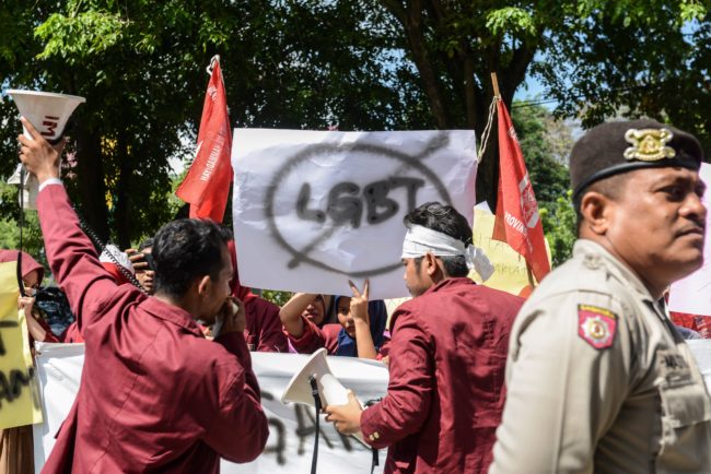 A group of Muslim protesters march with banners against the lesbian, gay, bisexual and transgender (LGBT) community in Banda Aceh on Decmber 27, 2017. There has been a growing backlash against Indonesia's small lesbian, gay, bisexual and transgender (LGBT) community over the past year, with ministers, hardliners and influential Islamic groups lining up to make anti-LGBT statements in public. / AFP PHOTO / Chaideer MAHYUDDIN (Photo credit should read CHAIDEER MAHYUDDIN/AFP/Getty Images)
