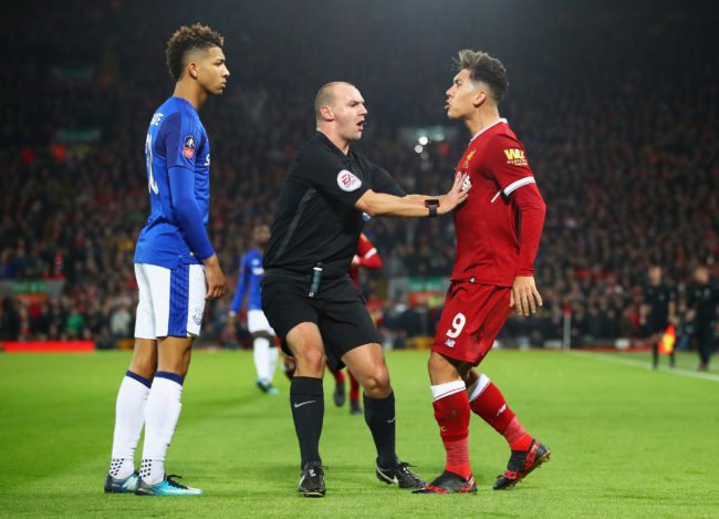 LIVERPOOL, ENGLAND - JANUARY 05:  Referee Robert Madley intervenes as Mason Holgate of Everton and Roberto Firmino of Liverpool clash during the Emirates FA Cup Third Round match between Liverpool and Everton at Anfield on January 5, 2018 in Liverpool, England.  (Photo by Clive Brunskill/Getty Images)