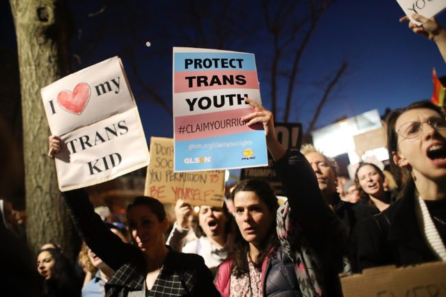 NEW YORK, NY - FEBRUARY 23: Hundreds protest a Trump administration announcement this week that rescinds an Obama-era order allowing transgender students to use school bathrooms matching their gender identities, at the Stonewall Inn on February 23, 2017 in New York City. Activists and members of the transgender community gathered outside the historic LGTB bar to denounce the new policy. (Photo by Spencer Platt/Getty Images)