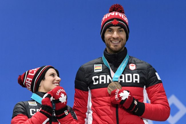 Canada's bronze medallists Meagan Duhamel (L) and Eric Radford pose on the podium during the medal ceremony for the figure skating pair event at the Pyeongchang Medals Plaza during the Pyeongchang 2018 Winter Olympic Games in Pyeongchang on February 15, 2018. / AFP PHOTO / Dimitar DILKOFF        (Photo credit should read DIMITAR DILKOFF/AFP/Getty Images)