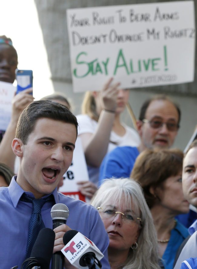 Marjory Stoneman Douglas High School student Cameron Kasky speaks at a rally for gun control at the Broward County Federal Courthouse in Fort Lauderdale, Florida on February 17, 2018.  Seventeen perished and more than a dozen were wounded in the hail of bullets at Marjory Stoneman Douglas High School in Parkland,Florida the latest mass shooting to devastate a small US community and renew calls for gun control. / AFP PHOTO / RHONA WISE        (Photo credit should read RHONA WISE/AFP/Getty Images)