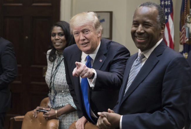 WASHINGTON, DC - FEBRUARY 1:  (AFP OUT) President Donald Trump holds an African American History Month listening session attended by nominee to lead the Department of Housing and Urban Development (HUD) Ben Carson (R), Director of Communications for the Office of Public Liaison Omarosa Manigault (L) and other officials in the Roosevelt Room of the White House on February 1, 2017 in Washington, DC. (Photo by Michael Reynolds - Pool/Getty Images)