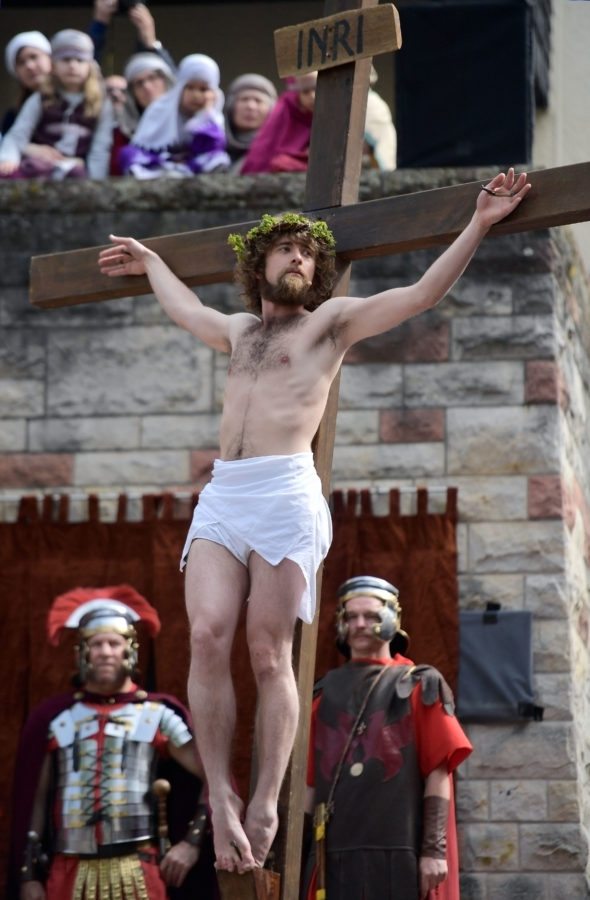 BENSHEIM, GERMANY - APRIL 14: Jesus Christ, played by amateur actor Julian Lux, is crucifying in the annual Good Friday procession on April 14, 2017 in Bensheim, Germany. This is the 35th year of the annual event shortly before Easter that around 100 actors and thousands of spectators commemorate the crucifixion and death of Jesus Christ. Germany is predominantly Catholic in the south and Protestant in the north and Easter is an intrinsic part of the country's Christian religious calendar. (Photo by Thomas Lohnes/Getty Images)