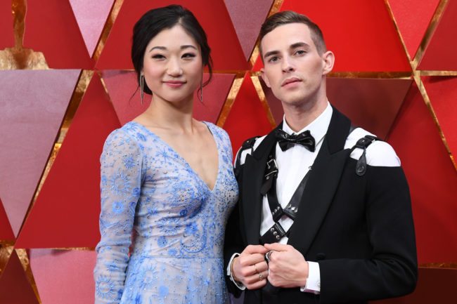 US figure skater Mirai Nagasu (L) and US Olympic medalist Adam Rippon arrive for the 90th Annual Academy Awards on March 4, 2018, in Hollywood, California. / AFP PHOTO / ANGELA WEISS (Photo credit should read ANGELA WEISS/AFP/Getty Images)