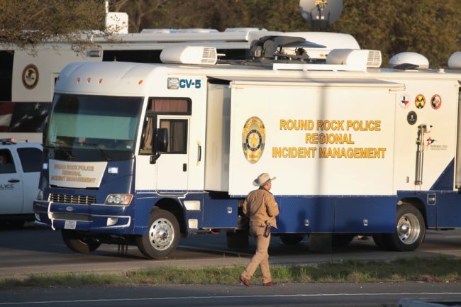ROUND ROCK, TX - MARCH 21: Law enforcement officials search for evidence at the location where the suspected package bomber was killed in suburban Austin on March 21, 2018 in Round Rock, Texas. Mark Anthony Conditt, the 24-year-old suspect, blew himself up inside his vehicle as police approached to take him into custody. A massive search had been underway by local and federal law enforcement officials in Austin and the surrounding area after several package bombs had detonated in recent weeks, killing two people and injuring several others. (Photo by Scott Olson/Getty Images)