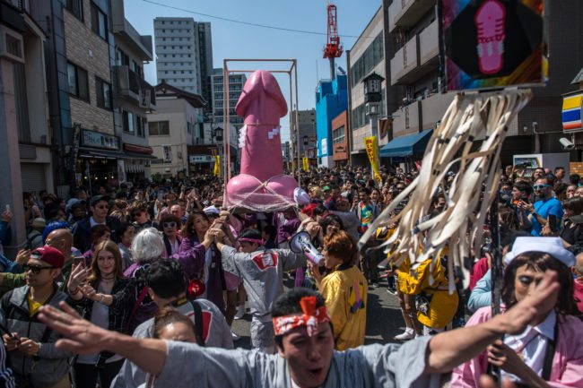 KAWASAKI, JAPAN - APRIL 01: (EDITORS NOTE: Image contains suggestive content.) A large pink phallic-shaped 'Mikoshi' is paraded through the streets during Kanamara Matsuri (Festival of the Steel Phallus) on April 1, 2018 in Kawasaki, Japan. The Kanamara Festival is held annually on the first Sunday of April. The penis is the central theme of the festival, focused at the local penis-venerating shrine which was once frequented by prostitutes who came to pray for business prosperity and protection against sexually transmitted diseases. Today the festival has become a popular tourist attraction and is used to raise money for HIV awareness and research. (Photo by Carl Court/Getty Images)