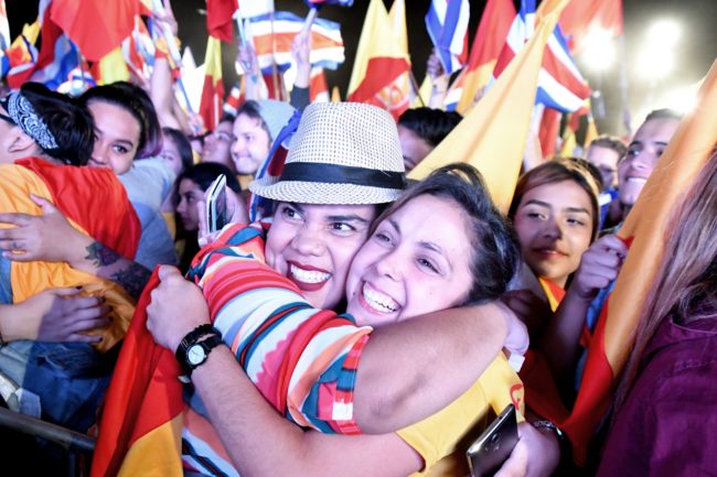 Supporters of the presidential candidate of Costa Rica's governing Citizen Action Party (PAC), Carlos Alvarado, celebrate in San Jose on April 01, 2018.  Carlos Alvarado, the candidate for Costa Rica's center-left ruling party, is to become his country's next president after an election run-off Sunday against an evangelical preacher, according a near-complete vote count by electoral authorities. Alvarado, a 38-year-old former labor minister, won 60.66 percent of the ballots, against 39.33 percent for his ultra-conservative rival, Fabricio Alvarado (no relation), the Supreme Electoral Tribunal said, based on returns from more than 90 percent of polling stations.  / AFP PHOTO / Ezequiel BECERRA        (Photo credit should read EZEQUIEL BECERRA/AFP/Getty Images)