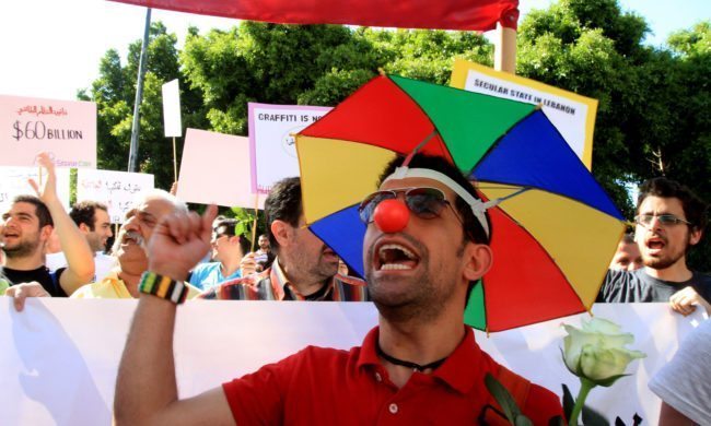 Lebanese demonstrators shout slogans during the Laique Pride III march, calling for equality amongst all Lebanese citizens in Beirut on May 6, 2012. The Laique Pride encourages and supports every movement and organization working towards a more egalitarian society and seeks to inspire new citizen initiatives in Lebanon. AFP PHOTO / ANWAR AMRO        (Photo credit should read ANWAR AMRO/AFP/GettyImages)