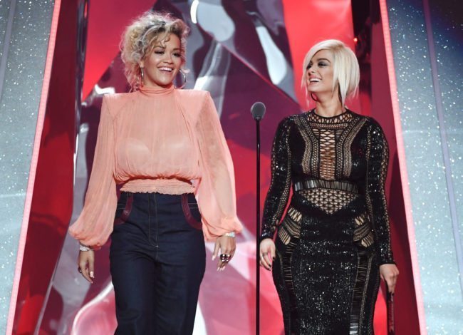 INGLEWOOD, CA - MARCH 11: Rita Ora (L) and Bebe Rexha speak onstage during the 2018 iHeartRadio Music Awards which broadcasted live on TBS, TNT, and truTV at The Forum on March 11, 2018 in Inglewood, California. (Photo by Kevin Winter/Getty Images for iHeartMedia)