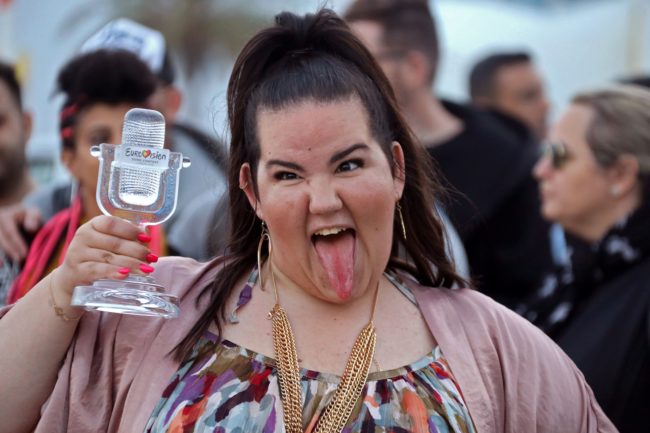 Israel's Netta Barzilai poses for a photograph with her trophy as she arrives at Ben Gurion Airport near Tel Aviv on May 14, 2018 after winning the Eurovision Song Contest on May 13 in Lisbon. - Netta Barzilai beat 25 other contestants with her uptempo song "Toy", whose lyrics were inspired by the #MeToo movement. The 25-year-old, who wore a multicoloured kimono, accompanied her winning performance with trills, clucking sounds and chicken-like dance moves in an eye-catching and bizarre performance that is often typical of the Eurovision contest. (Photo by GIDEON MARKOWICZ / AFP) / Israel OUT        (Photo credit should read GIDEON MARKOWICZ/AFP/Getty Images)