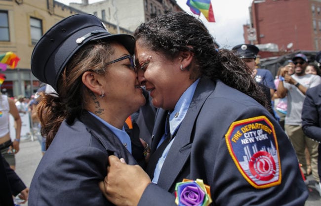 NEW YORK, NY - JUNE 24:  EMT Trudy Bermudez and paramedic Tayreen Bonilla of New York City Fire Department get engaged at the annual Pride Parade on June 24, 2018 in New York City. The first gay pride parade in the U.S. was held in Central Park on June 28, 1970.  (Photo by Kena Betancur/Getty Images)