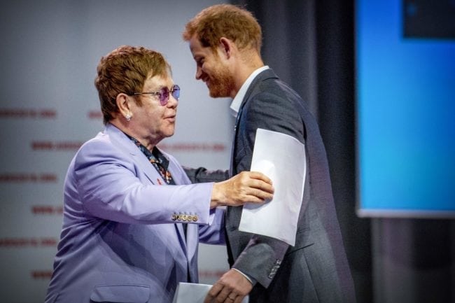 British Prince Harry (L) and sir Elton John attend a session about the Elton John Aids Fund on the second day of the Aids2018 conference, in Amsterdam on July 24, 2018. - From 23 to July 27, thousands of delegates -- researchers, campaigners, activists and people living with the killer virus -- attend the 22nd International AIDS Conference amid warnings that "dangerous complacency" may cause an unstoppable resurgence. (Photo by Robin Utrecht / ANP / AFP) / Netherlands OUT (Photo credit should read ROBIN UTRECHT/AFP/Getty Images)