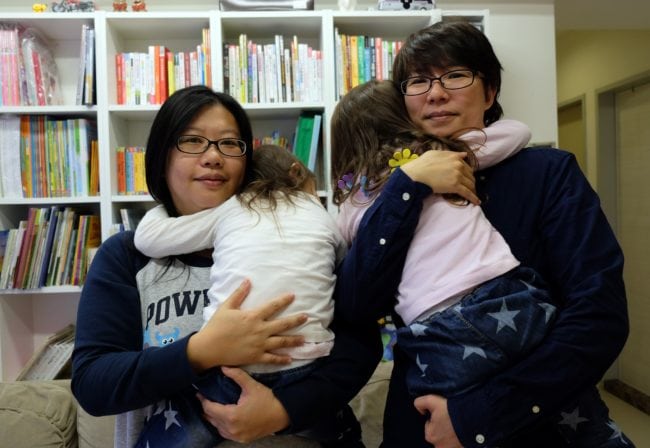 Same-sex couples such as Hope Chen (L), 37, and Zoro Wen, 34, raise children who perform better at school, a study indicated.