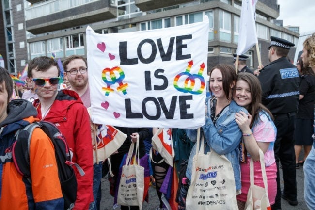 GLASGOW, SCOTLAND - AUGUST 19: Participants hold a sign that says "Love is Love" during the Glasgow Pride march on August 19, 2017 in Glasgow, Scotland. The largest festival of LGBTI celebration in Scotland has been held every year in Glasgow since 1996. (Photo by Robert Perry/Getty Images)