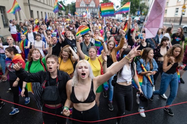 Participants of a gay pride parade walk through the streets of Poznan, August 11, 2018. (Photo by Wojtek RADWANSKI / AFP)        (Photo credit should read WOJTEK RADWANSKI/AFP/Getty Images)