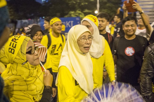 KUALA LUMPUR, MALAYSIA - AUGUST 31: Malaysian opposition leader Wan Azizah Wan Ismail, the wife of opposition icon Anwar Ibrahim, leaves the Bersih 4.0 rally on August 31, 2015 in Kuala Lumpur, Malaysia. Prime Minister Najib Razak has become embroiled in a scandal involving state fund debts and allegations of deposits totaling 2.6 billion ringgit paid to his bank account. Razak has denied any wrongdoing. Thousand of people gathered to demand his resignation and a new general election.  (Photo by Charles Pertwee/Getty Images)