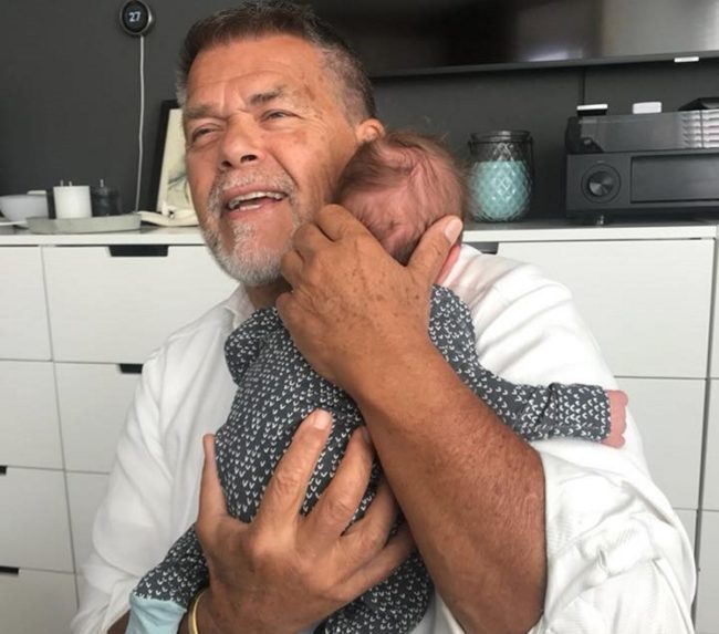 Emile Ratelband holds a baby
