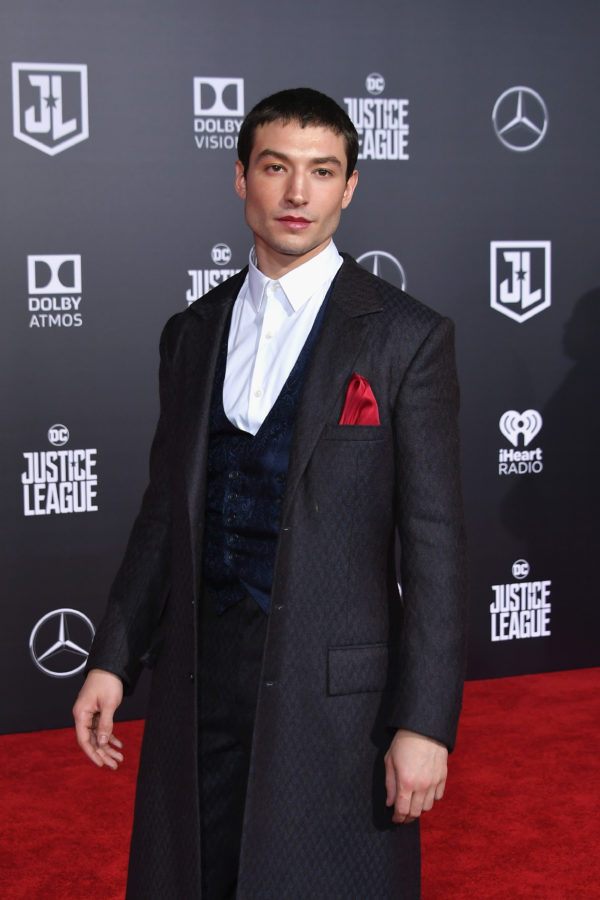 Fantastic Beasts' Ezra Miller wearing a suit at the premiere of Justice League