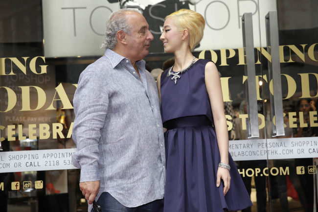 Sir Philip Green the owner of Topshop poses with Taiwanese actress Gwei Lun Mei at the opening of the new Topshop store on June 6, 2013 in Hong Kong, Hong Kong