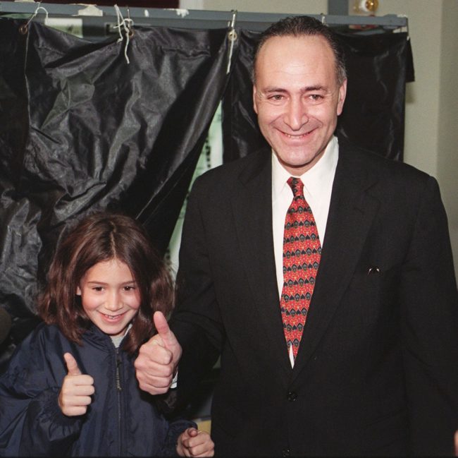 Chuck Schumer and his daughter Alison Schumer, give a thumbs-up after voting near their home in Brooklyn, New York, November 3, 1998. 