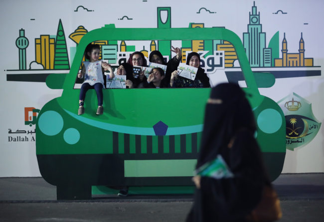 Teenage girls pictured in Saudi Arabia, where textbooks still promote violence against women, those engaging in gay sex, and religious minorities.
