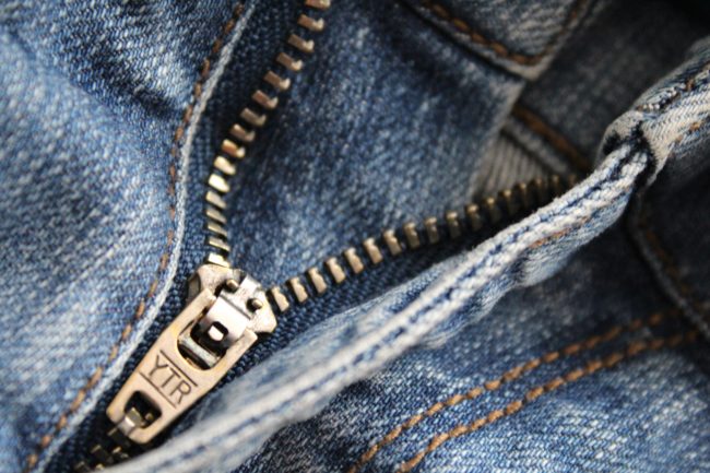 Zipper on a pair of jeans.