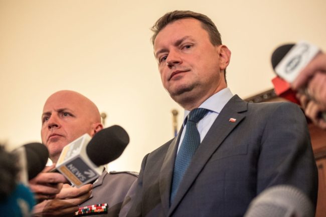 Poland's Defence Minister Mariusz Blaszczak speaks to press