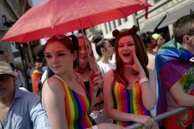 Two people enjoy the annual Pride Parade in London on July 7, 2018