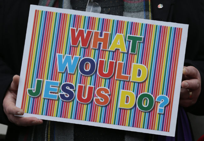  LGBT rainbow sign saying 'What would Jesus do?'