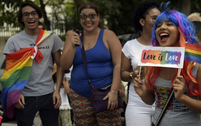 Members of the LGBT community and activists staged a kiss-in and demonstrate in front of Carmen church in Panama City.